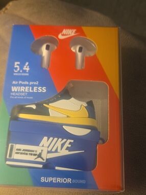 Nike Blue and Yellow Wireless Earbuds with Shoe-Themed Charging Case